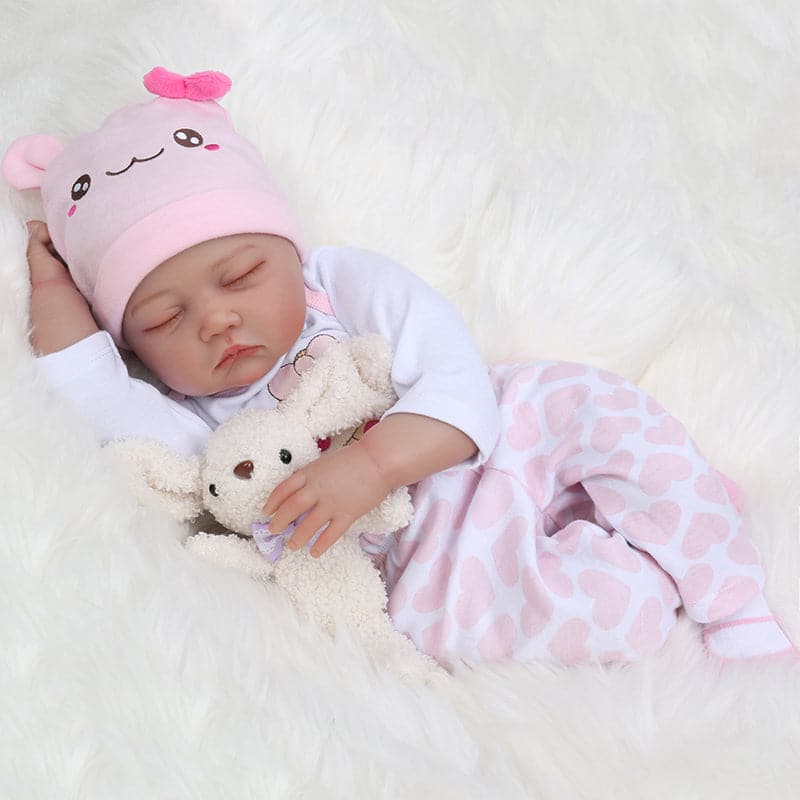 For the Kaydora lifelike baby doll Evie, people can't miss her. She is 22 inches long with closed eyes. She is so lifelike featuring hand-rooted hair and eyelashes, as well as hand-rooted hair and eyelashes. Most people see dolls as a real human baby.